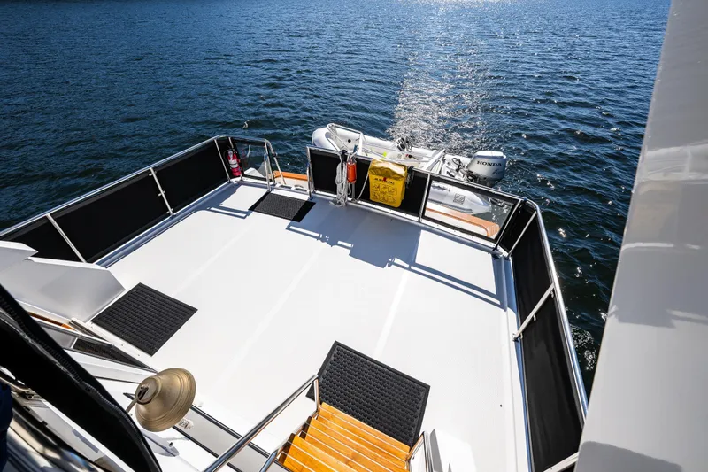 Slide: The Image of Ocean Alexander 42 yacht deck, 1989 model, overlooking calm blue waters. - 35