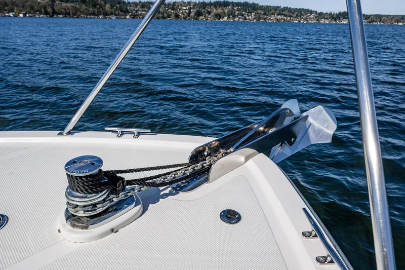 Slide: The Image of Bow of 1989 Ocean Alexander 42 yacht with anchor and winch on calm water. - 37