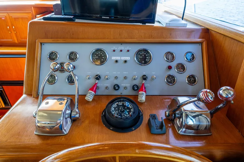 Slide: The Image of Control panel of a 1989 Ocean Alexander 42 yacht with gauges and levers. - 40