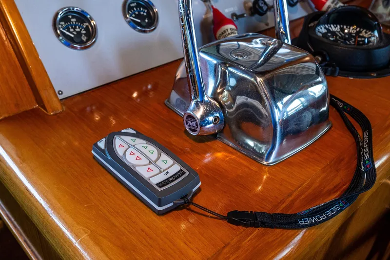 Slide: The Image of Control panel of a 1989 Ocean Alexander 42 yacht with remote and throttle. - 41