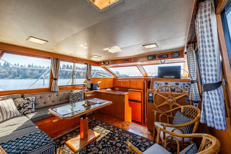 Slide: The Image of Luxurious interior of 1989 Ocean Alexander 42 yacht with elegant seating and helm. - 44