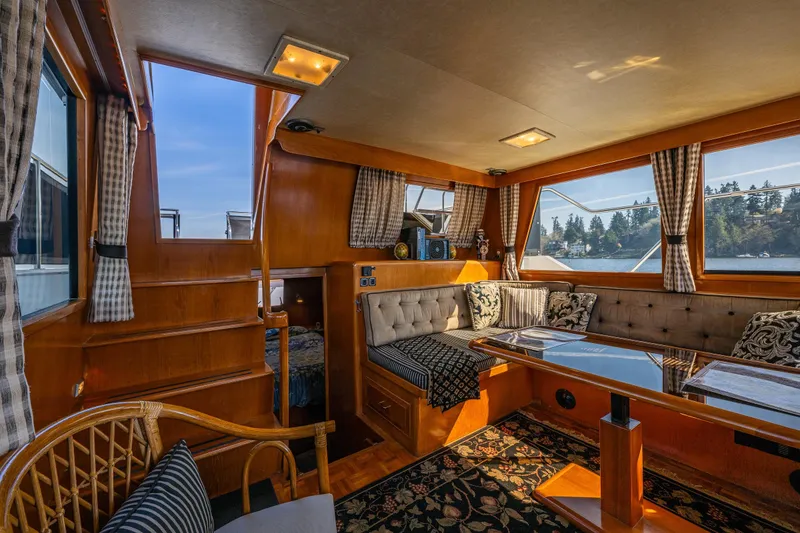 Slide: The Image of Luxurious interior of 1989 Ocean Alexander 42 yacht with elegant seating and scenic views. - 45
