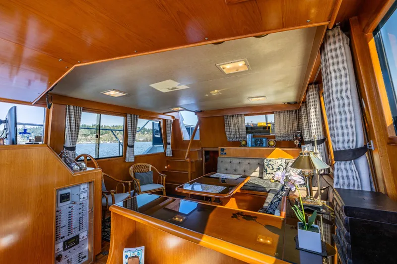 Slide: The Image of Luxurious interior of a 1989 Ocean Alexander 42 yacht with elegant wood finishes. - 46