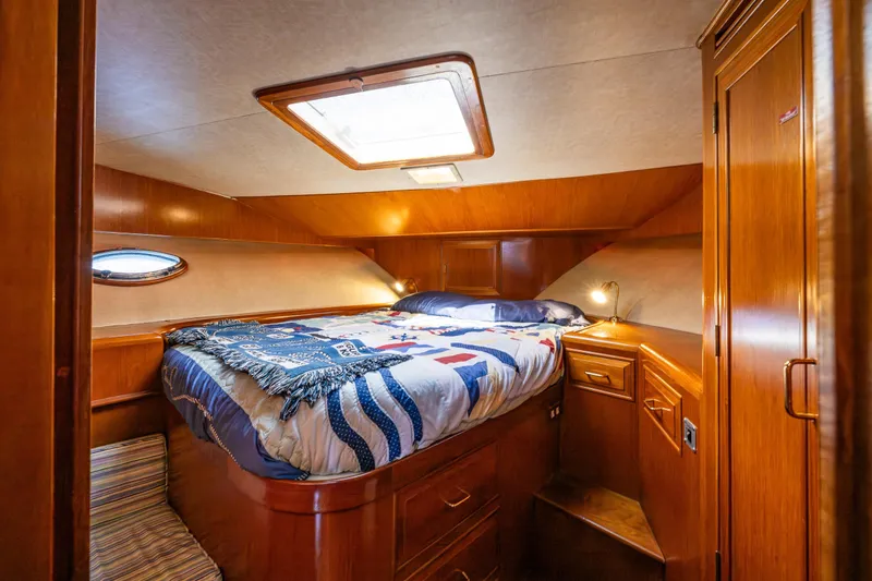 Slide: The Image of Cozy cabin interior of 1989 Ocean Alexander 42 yacht with wooden furnishings and skylight. - 55