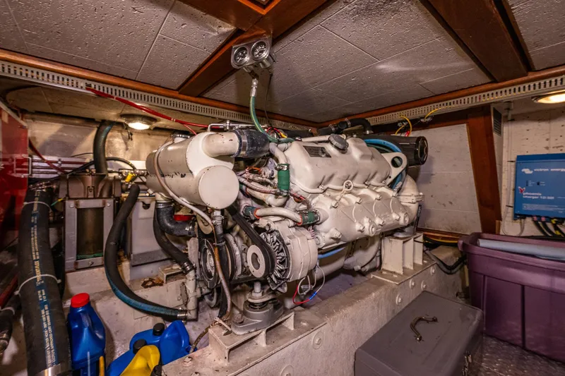 Slide: The Image of Engine room of a 1989 Ocean Alexander 42 yacht, showcasing machinery and equipment. - 64