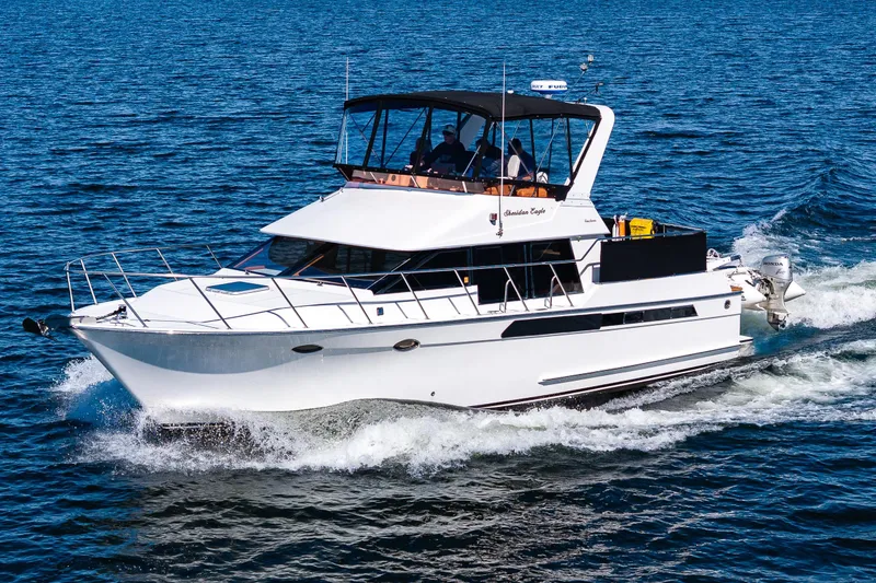 Slide: The Image of 1989 Ocean Alexander 42 yacht cruising on open water. - 9