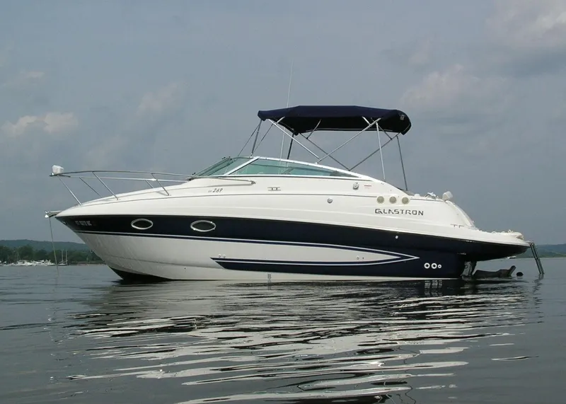 Slide: The Image of 2006 Glastron GS 269 boat on calm water. - 1