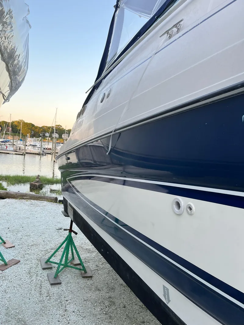 Slide: The Image of Interior of a 2006 Glastron GS 269 boat with blue canopy. - 11