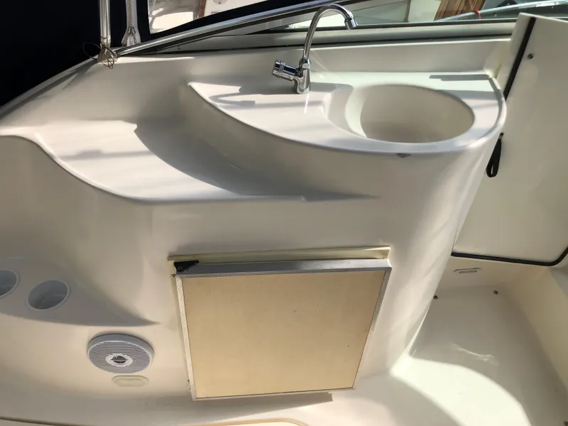 Slide: The Image of Interior of a 2006 Glastron GS 269 with cozy seating area. - 17