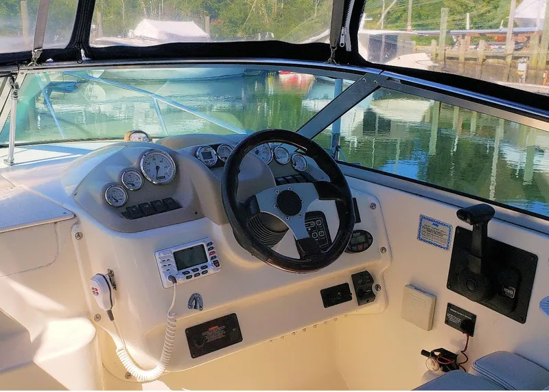 Slide: The Image of Interior of a 2006 Glastron GS 269 with cozy seating and cushions. - 18