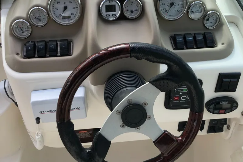 Slide: The Image of Interior of a 2006 Glastron GS 269 yacht with kitchenette and seating area. - 19