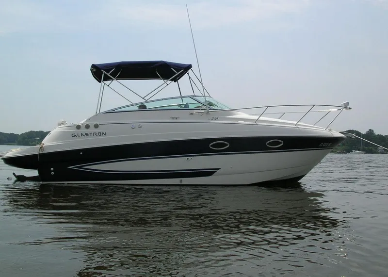 Slide: The Image of 2006 Glastron GS 269 boat on calm water. - 2