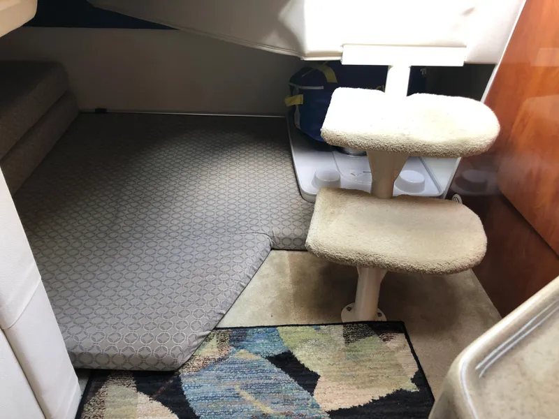 Slide: The Image of Engine compartment of a 2006 Glastron GS 269 boat, showing engine and components. - 24