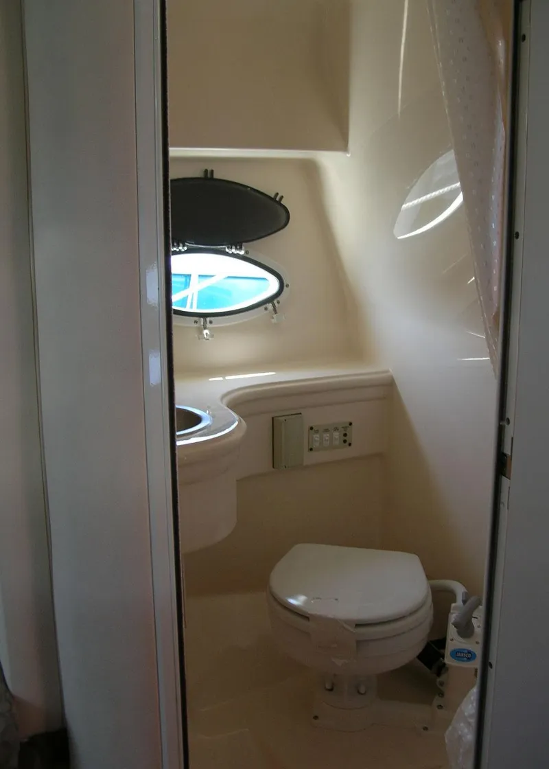 Slide: The Image of Electrical components in the engine room of a 2006 Glastron GS 269 boat. - 25