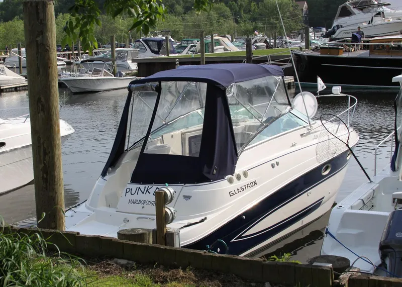 Slide: The Image of 2006 Glastron GS 269 boat docked with US flag. - 4