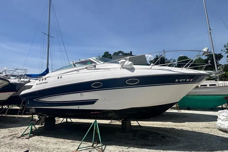 Slide: The Image of Side view of a 2006 Glastron GS 269 boat in harbor. - 8