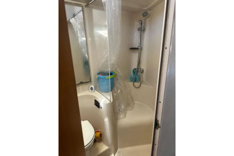 Slide: The Image of Bathroom of 1991 Mainship Mediterranean 36 Express with shower and toilet. - 6