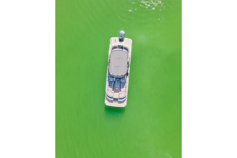 Slide: The Image of Aerial view of 2018 Bennington 25 QSR boat on vibrant green water. - 18