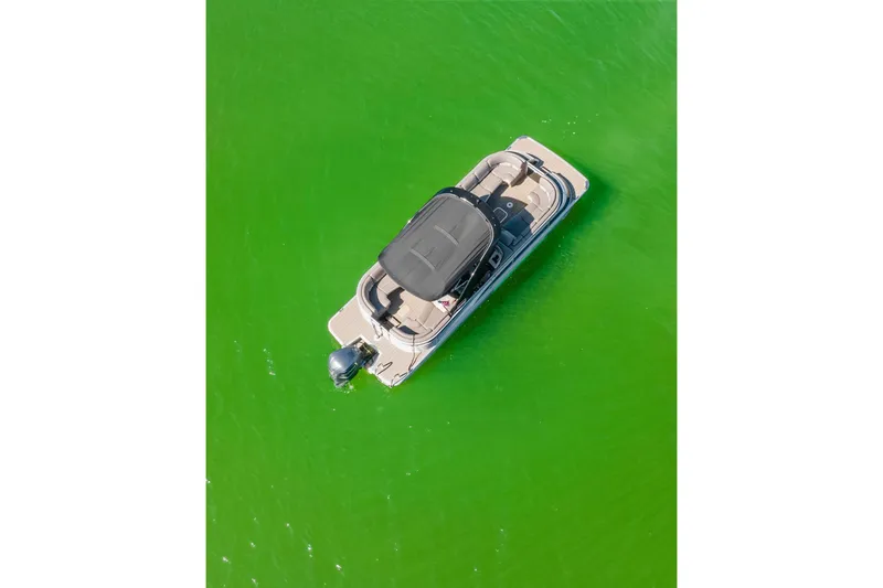 Slide: The Image of Aerial view of 2018 Bennington 25 QSR pontoon boat on vibrant green water. - 6
