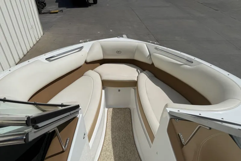 Slide: The Image of 2016 Cobalt 220 boat interior with beige and white seating. - 13