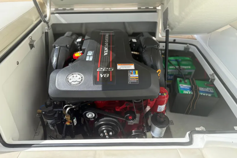 Slide: The Image of Volvo Penta V8 engine in a 2016 Cobalt 220 boat, with visible batteries. - 24