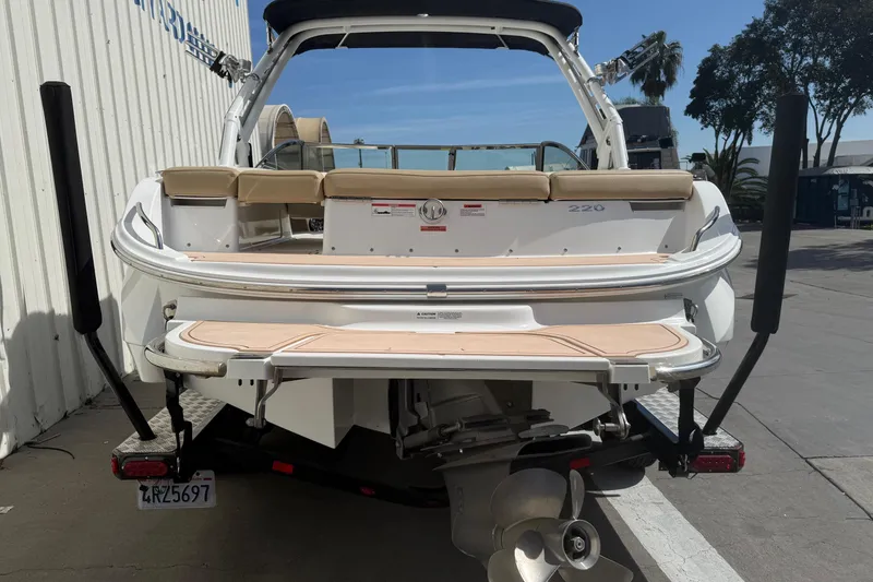 Slide: The Image of Rear view of a 2016 Cobalt 220 boat with swim platform and seating. - 5
