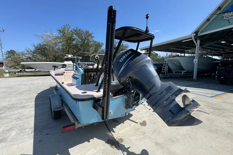 Slide: The Image of 2004 Kenner 21 VX boat with Yamaha outboard motor on trailer in marina. - 14