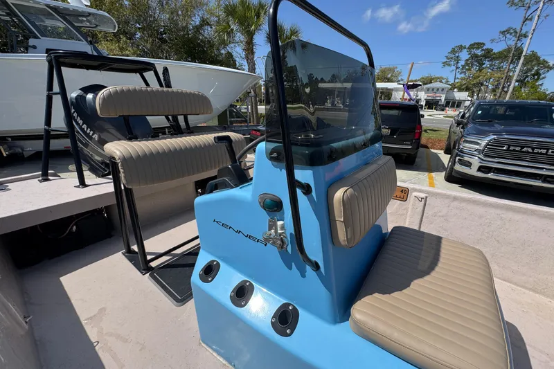 Slide: The Image of 2004 Kenner 21 VX boat with Yamaha engine, featuring blue console and beige seating. - 29