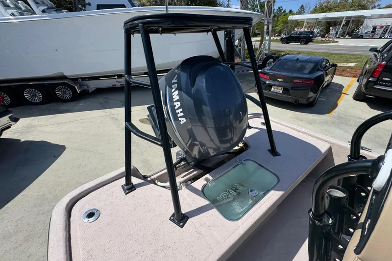 Slide: The Image of 2004 Kenner 21 VX boat with Yamaha outboard motor in parking lot. - 39