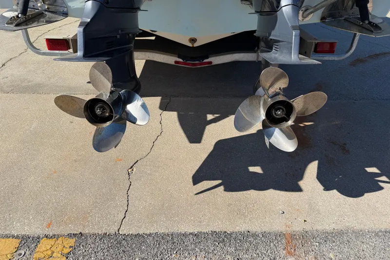Slide: The Image of Twin propellers of a 2007 Cobia 312 Sport Cabin boat on a trailer. - 17