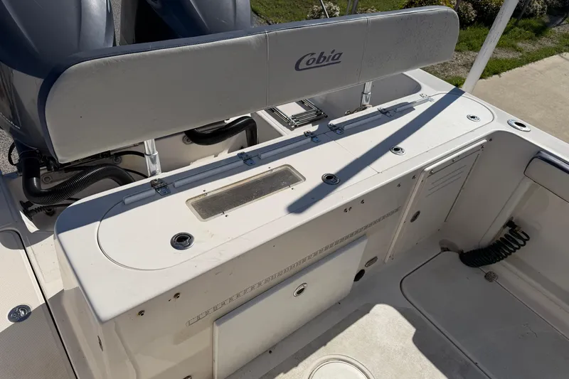 Slide: The Image of 2007 Cobia 312 Sport Cabin boat interior with seating and storage compartments. - 31