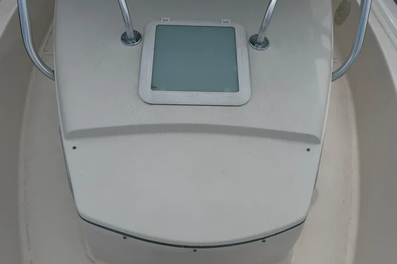 Slide: The Image of 2007 Cobia 312 Sport Cabin deck with hatch and metal railings. - 6