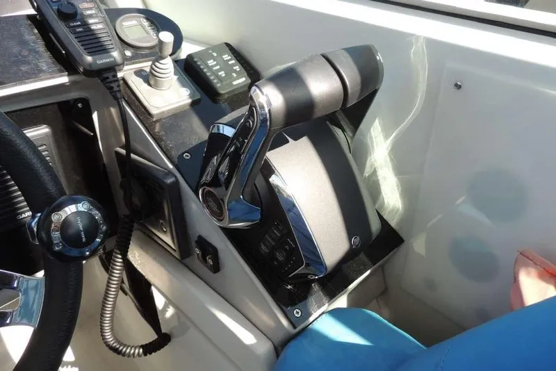 Slide: The Image of Control panel of a 2001 Formula 400 Super Sport boat with throttle and communication devices. - 14