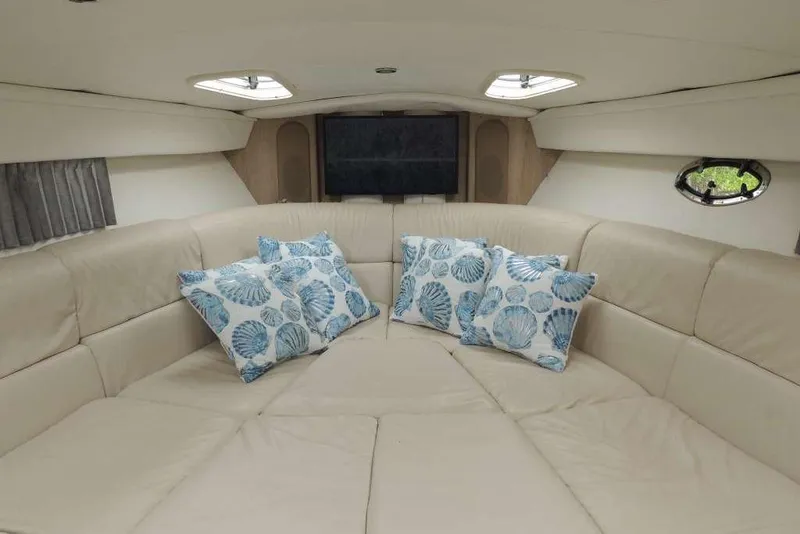 Slide: The Image of Luxurious interior of 2001 Formula 400 Super Sport yacht with plush seating and decorative pillows. - 15