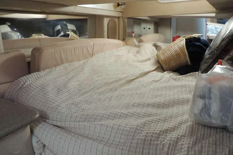 Slide: The Image of Interior cabin of a 2001 Formula 400 Super Sport boat with cozy bedding. - 17