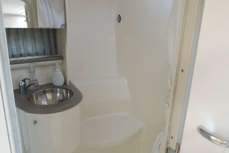 Slide: The Image of Interior of 2001 Formula 400 Super Sport boat bathroom with sink and shower. - 20