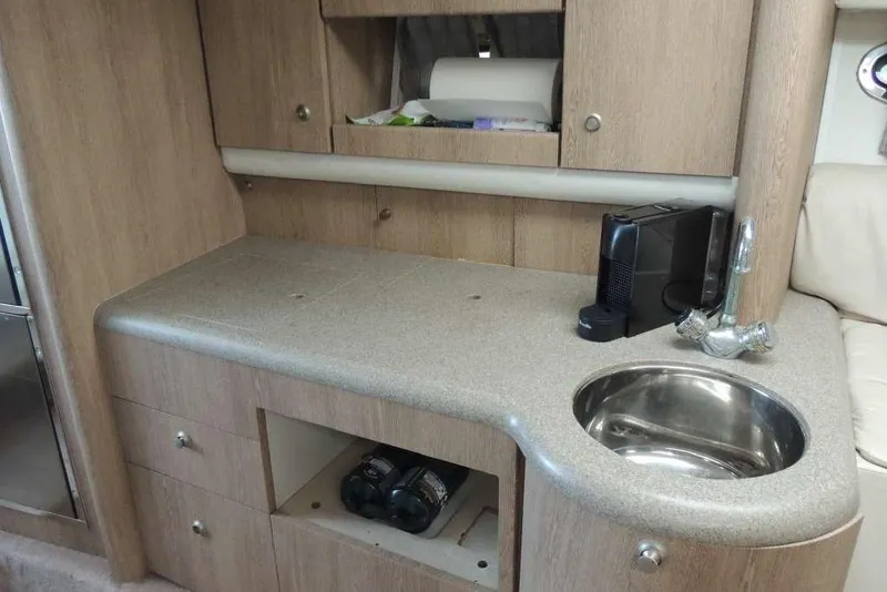 Slide: The Image of Interior of 2001 Formula 400 Super Sport yacht with kitchenette and sink. - 23