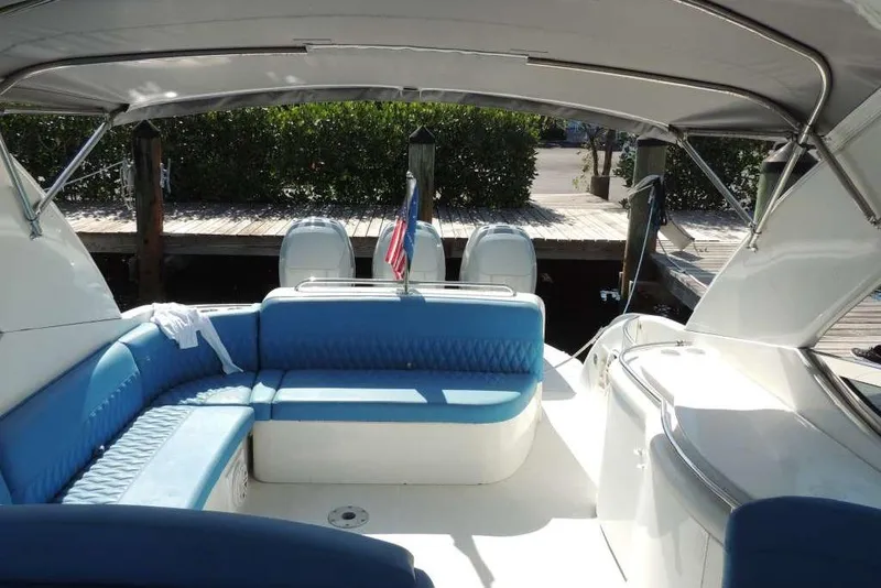 Slide: The Image of 2001 Formula 400 Super Sport boat interior with blue seating and canopy. - 26