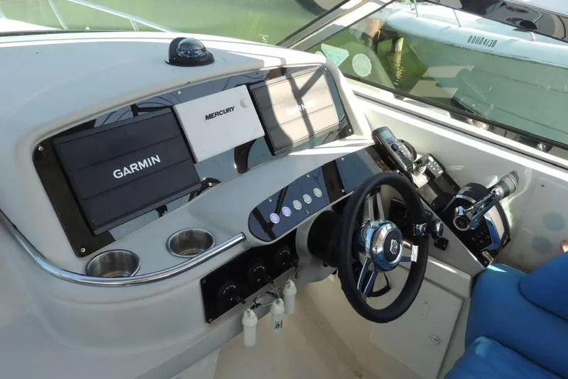 Slide: The Image of Control panel of a 2001 Formula 400 Super Sport boat with Garmin and Mercury displays. - 7