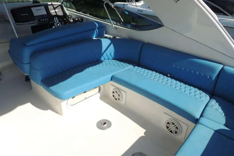 Slide: The Image of 2001 Formula 400 Super Sport boat with blue seating and modern dashboard. - 8