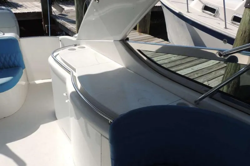 Slide: The Image of Interior view of a 2001 Formula 400 Super Sport boat with blue seating. - 9