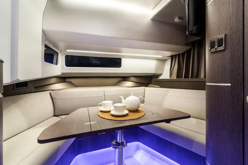 Slide: The Image of Manufacturer Provided Image: Interior of 2024 Galeon 325 GTO yacht with cozy seating and tea set. - 13