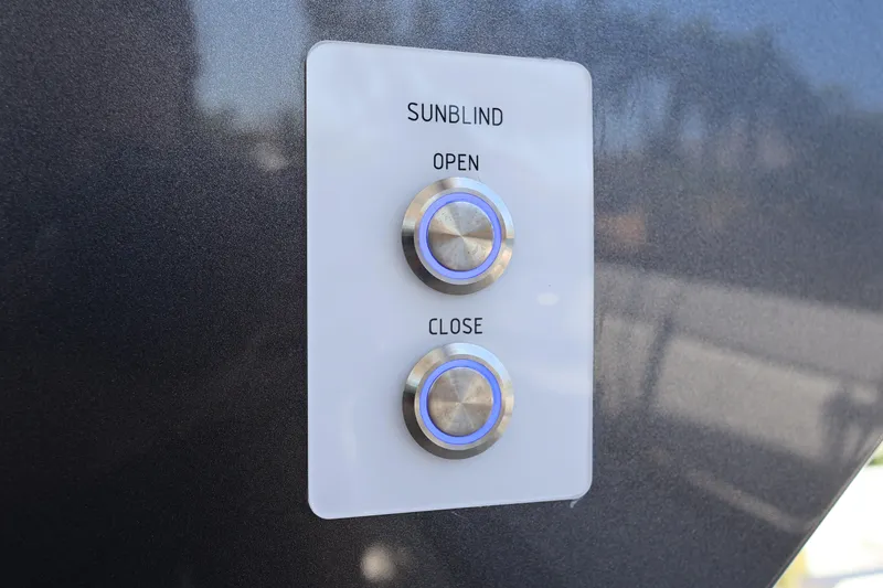 Slide: The Image of 2024 Galeon 325 GTO boat interior with open storage compartment and cushioned seating. - 19