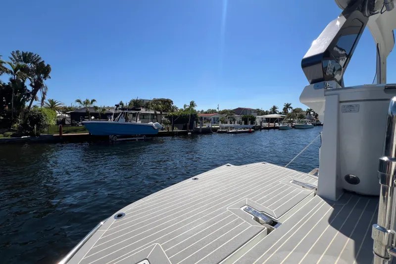 Slide: The Image of 2024 Galeon 325 GTO boat deck with waterfront view. - 21