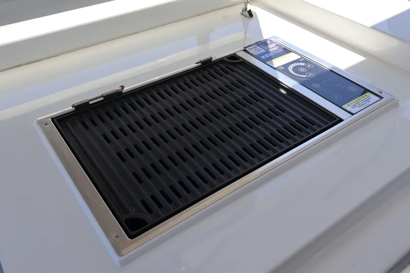 Slide: The Image of 2024 Galeon 325 GTO yacht with outdoor kitchen and grill setup. - 24