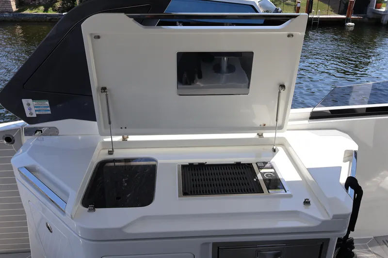 Slide: The Image of Built-in grill on 2024 Galeon 325 GTO yacht, featuring sleek design and control panel. - 25