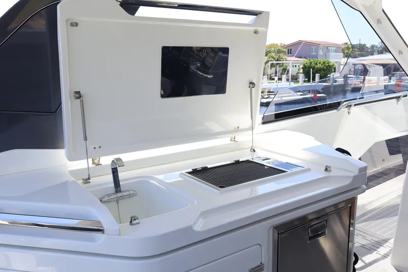 Slide: The Image of Outdoor grill station on 2024 Galeon 325 GTO yacht, dockside view. - 26