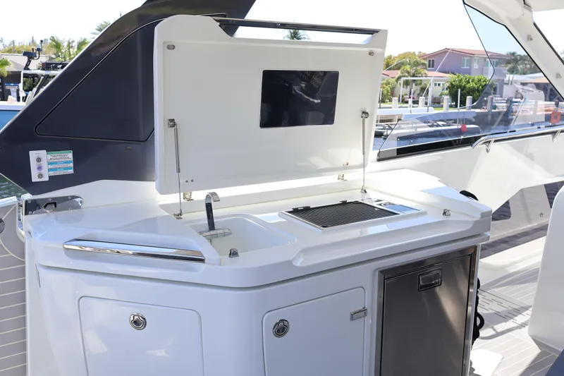 Slide: The Image of 2024 Galeon 325 GTO yacht kitchenette with sleek cabinetry and stainless steel accents. - 28