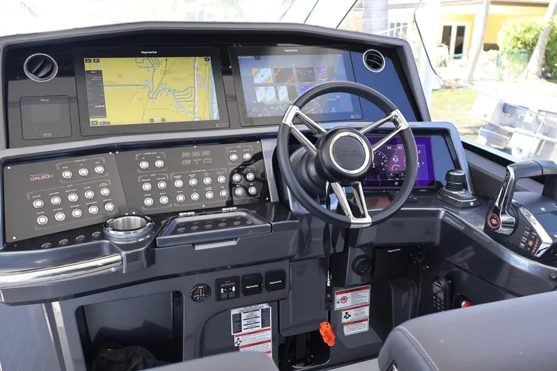 Slide: The Image of 2024 Galeon 325 GTO helm with advanced navigation displays and control panel. - 31