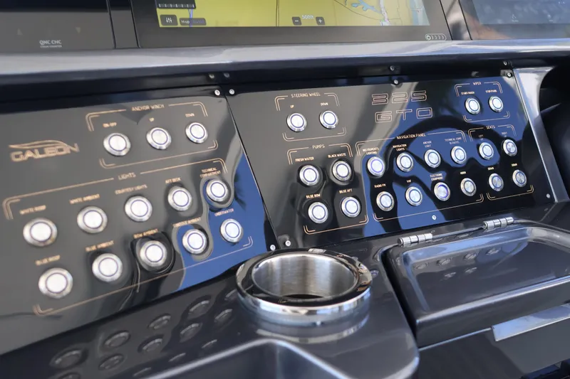 Slide: The Image of Control panel of 2024 Galeon 325 GTO yacht with various buttons and navigation features. - 35